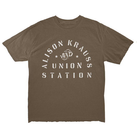 A brown t-shirt with the white arched text design 'Alison Krauss and Union Station' on the front.